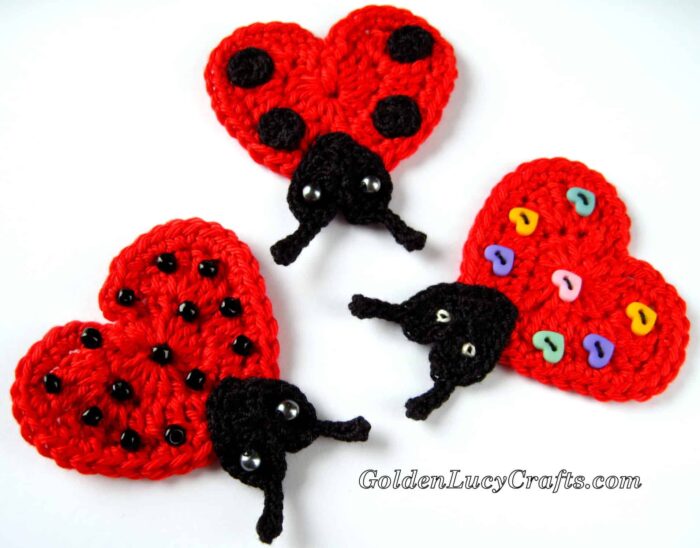 Crochet heart-shaped ladybug appliques.