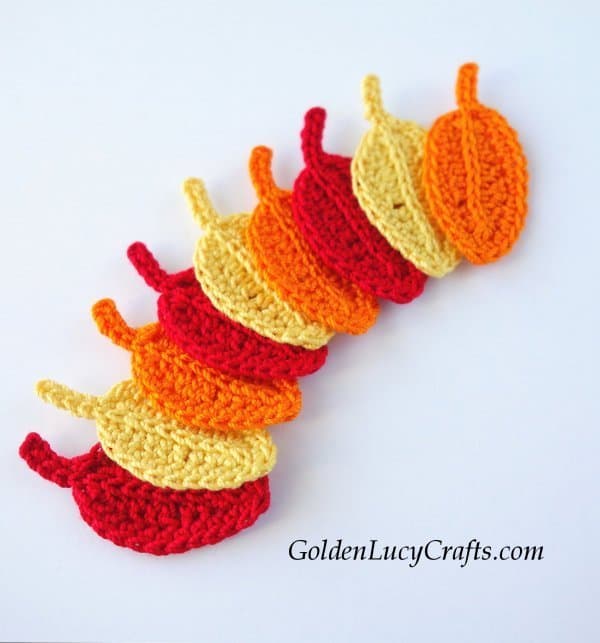 Crochet leaf in red, yellow and orange colors.