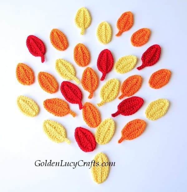 Crocheted leaves in Fall color arranged in shape of tree. 