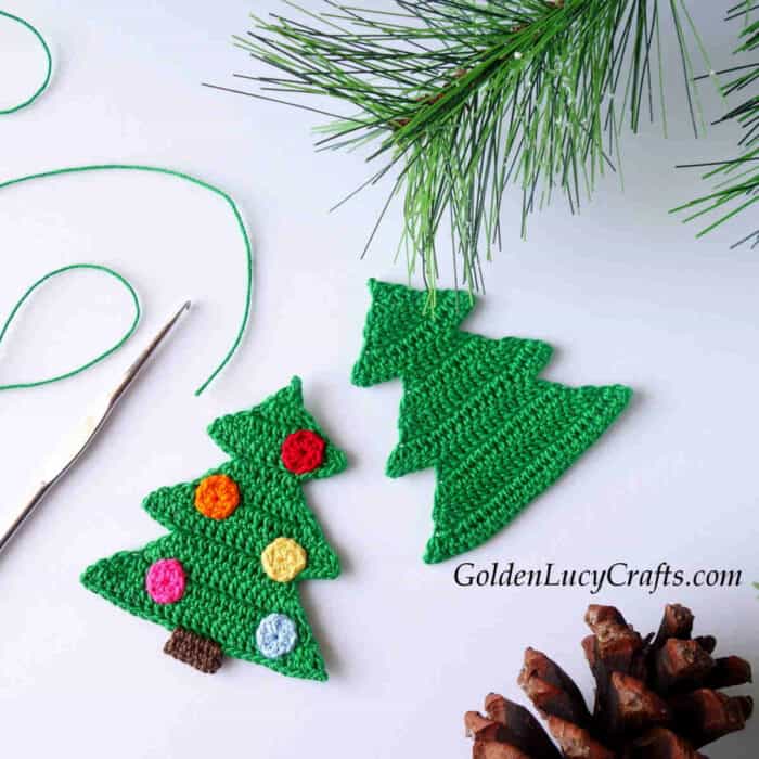 Two crocheted Christmas tree appliques.