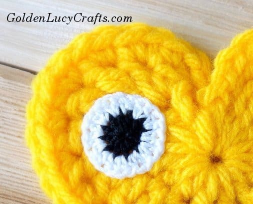 Crocheted eye close up picture.
