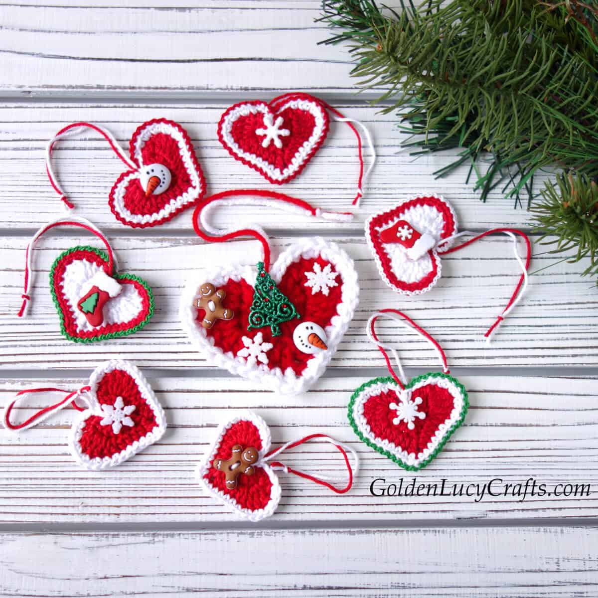 Crochet Christmas heart ornaments in red, white and green colors embellished with Christmas themed buttons.