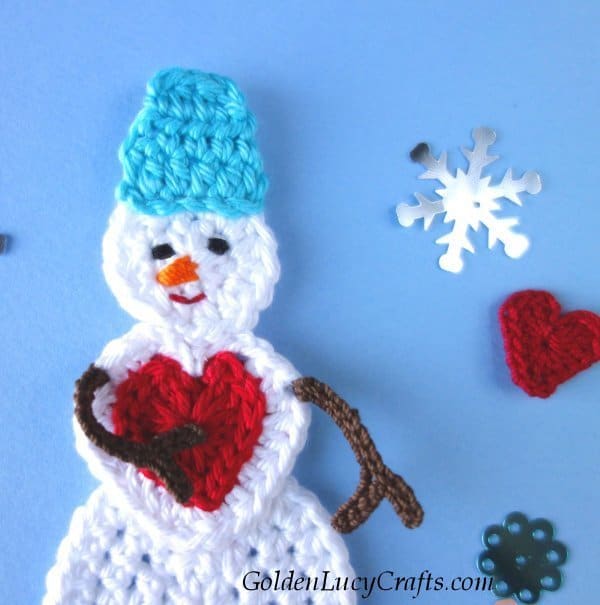 Crochet snowman applique close up picture.