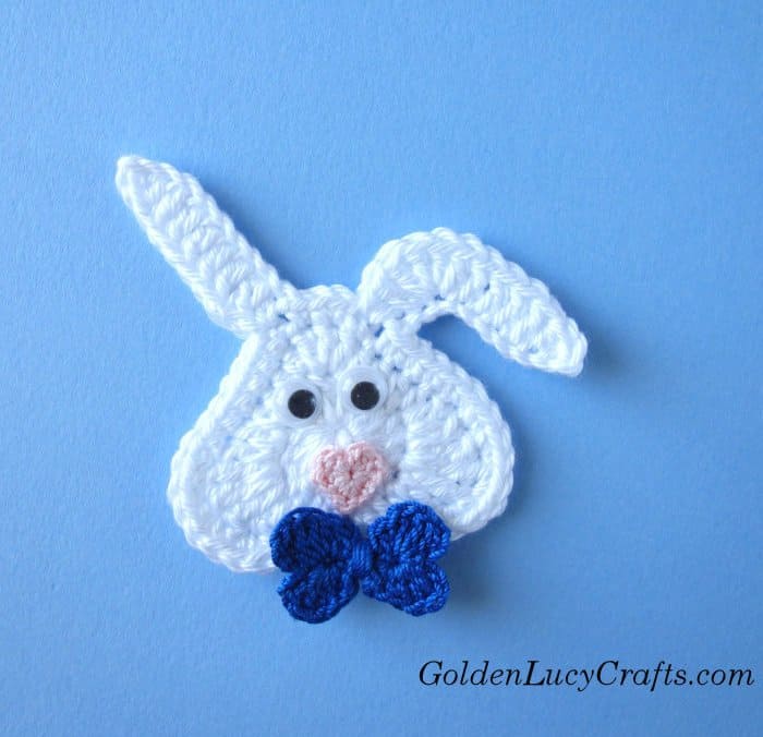 Crochet applique Bunny with blue bow.