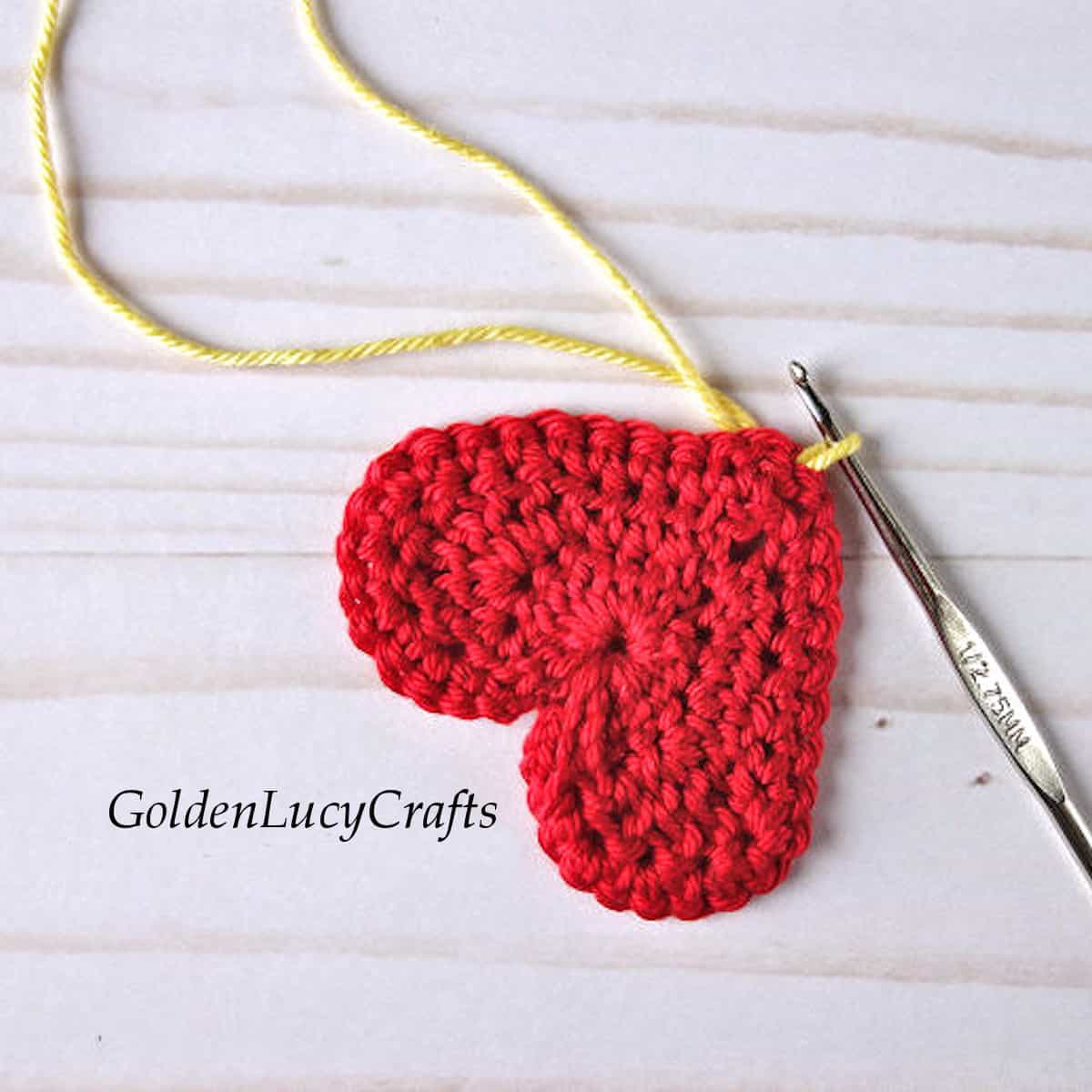 Process shot of crocheting a heart snail.