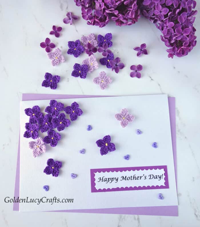 Mother's Day card embellished with crochet lilac flowers, real lilac branch in the background.