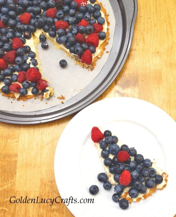 Berry pizza in a pan, slice of berry pizza on a plate
