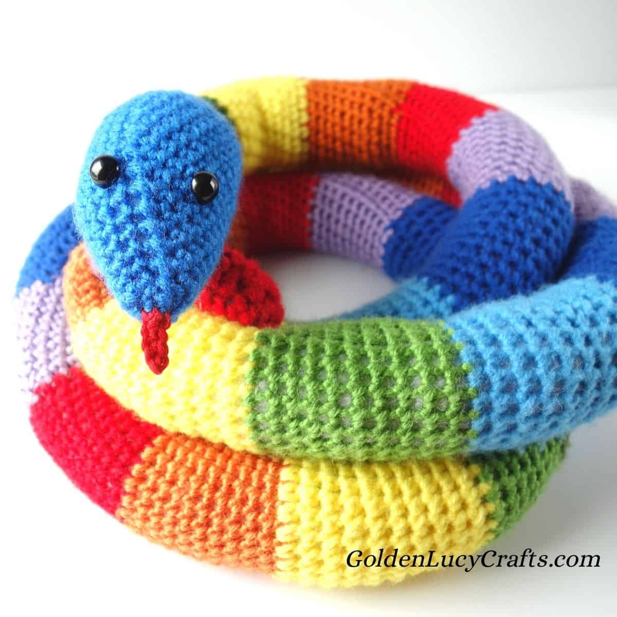 Crocheted rainbow snake.