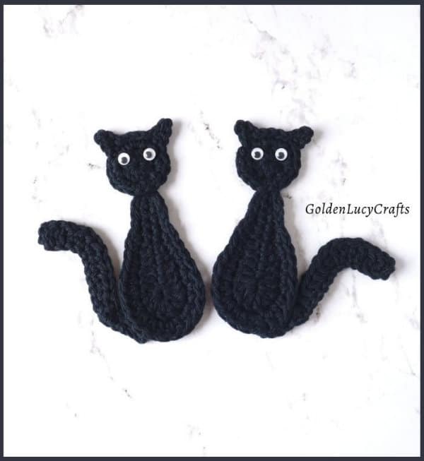 Two crochet black cats appliques.