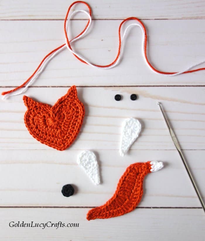 Parts of crocheted fox applique.