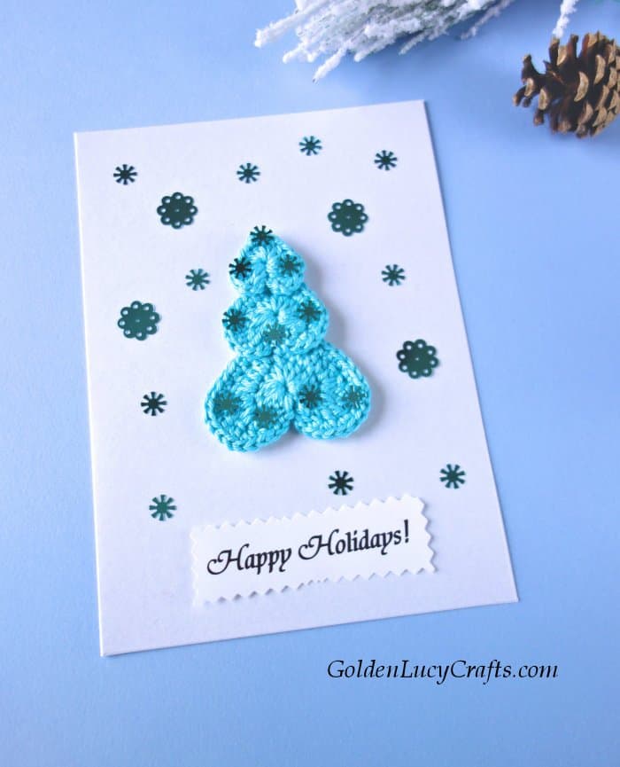 Handmade Christmas card, embellished with crochet Christmas tree applique and sequins. 