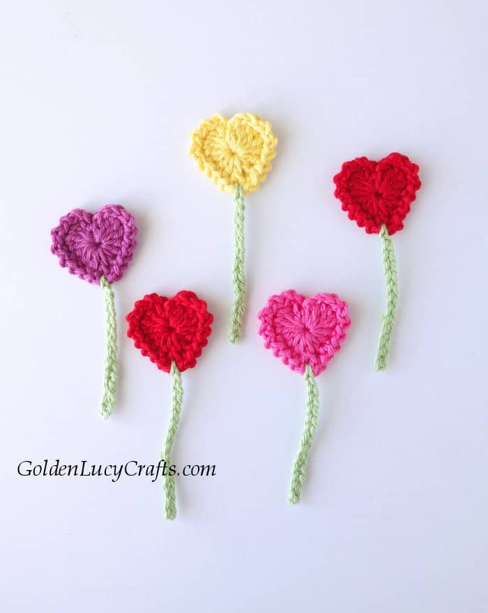 Crochet applique heart flowers.
