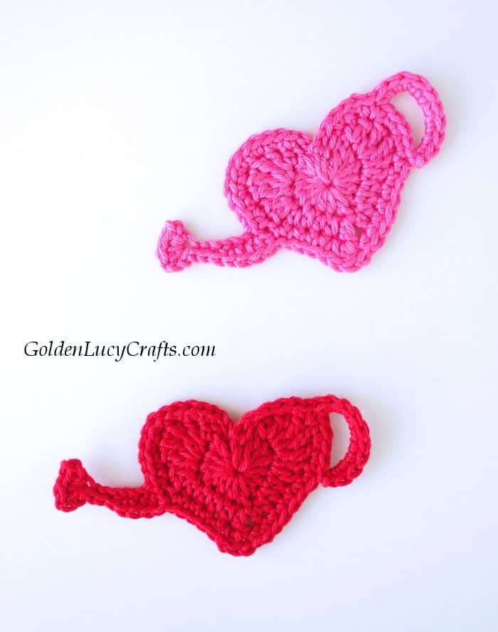 Two heart shaped watering can crochet applique.