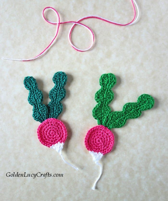 Two crocheted radish appliques.