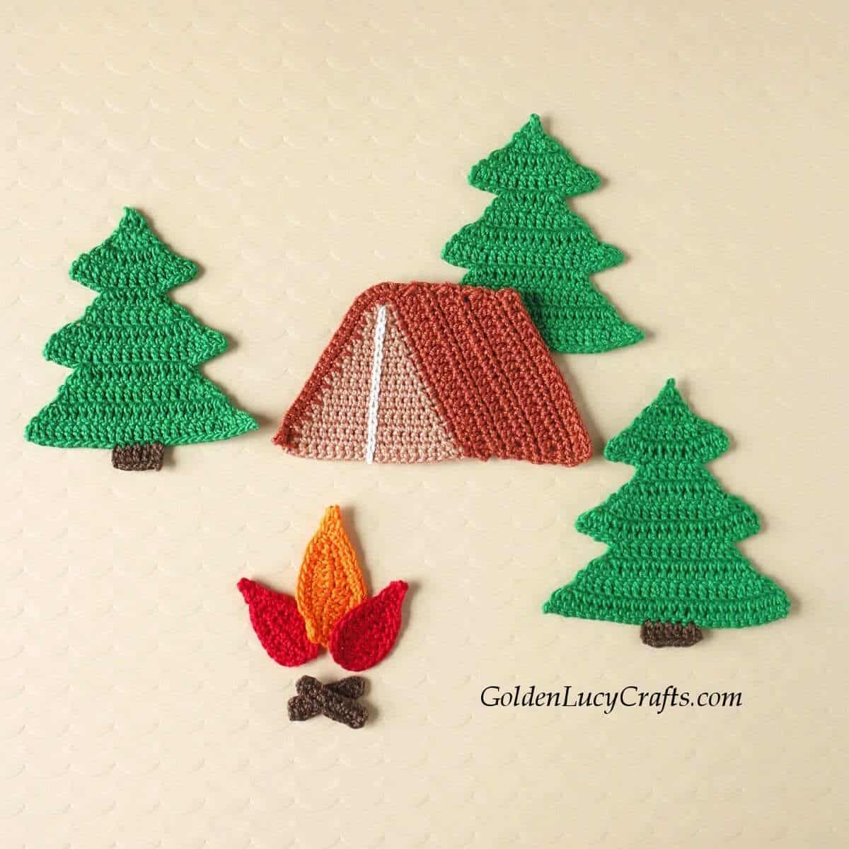 Crochet tent, fire and fir trees applique.