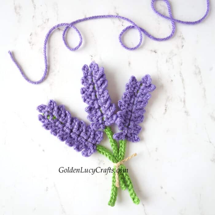 Crocheted lavender applique.