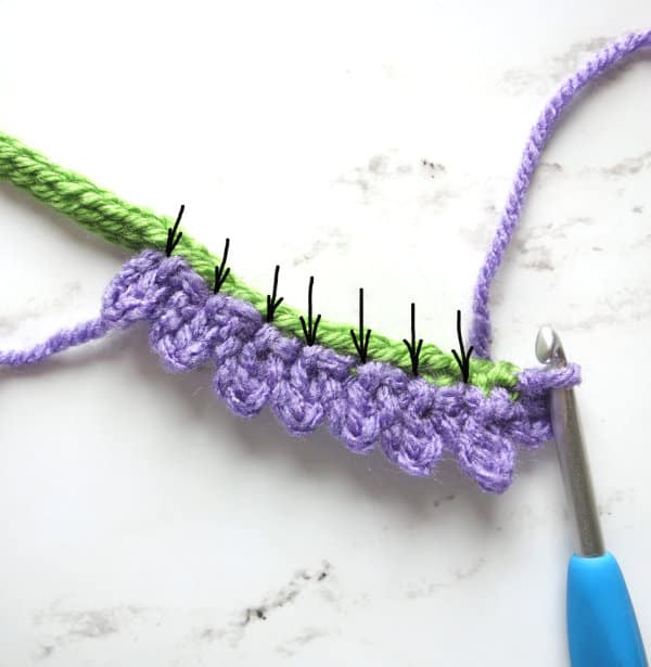 Crocheting lavender flowers - process shot.