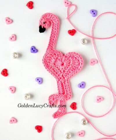 Crocheted heart shaped flamingo applique, small heart buttons.