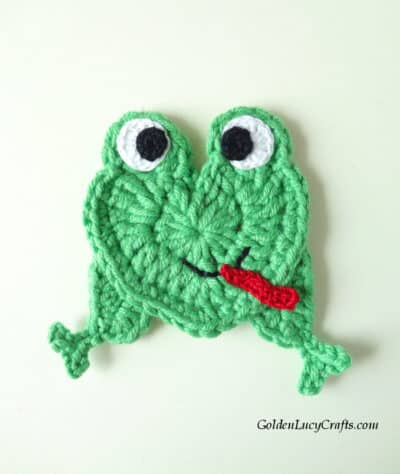 Heart-shaped frog crochet applique.
