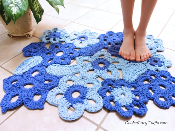 Barefeet on the crocheted flower rug.