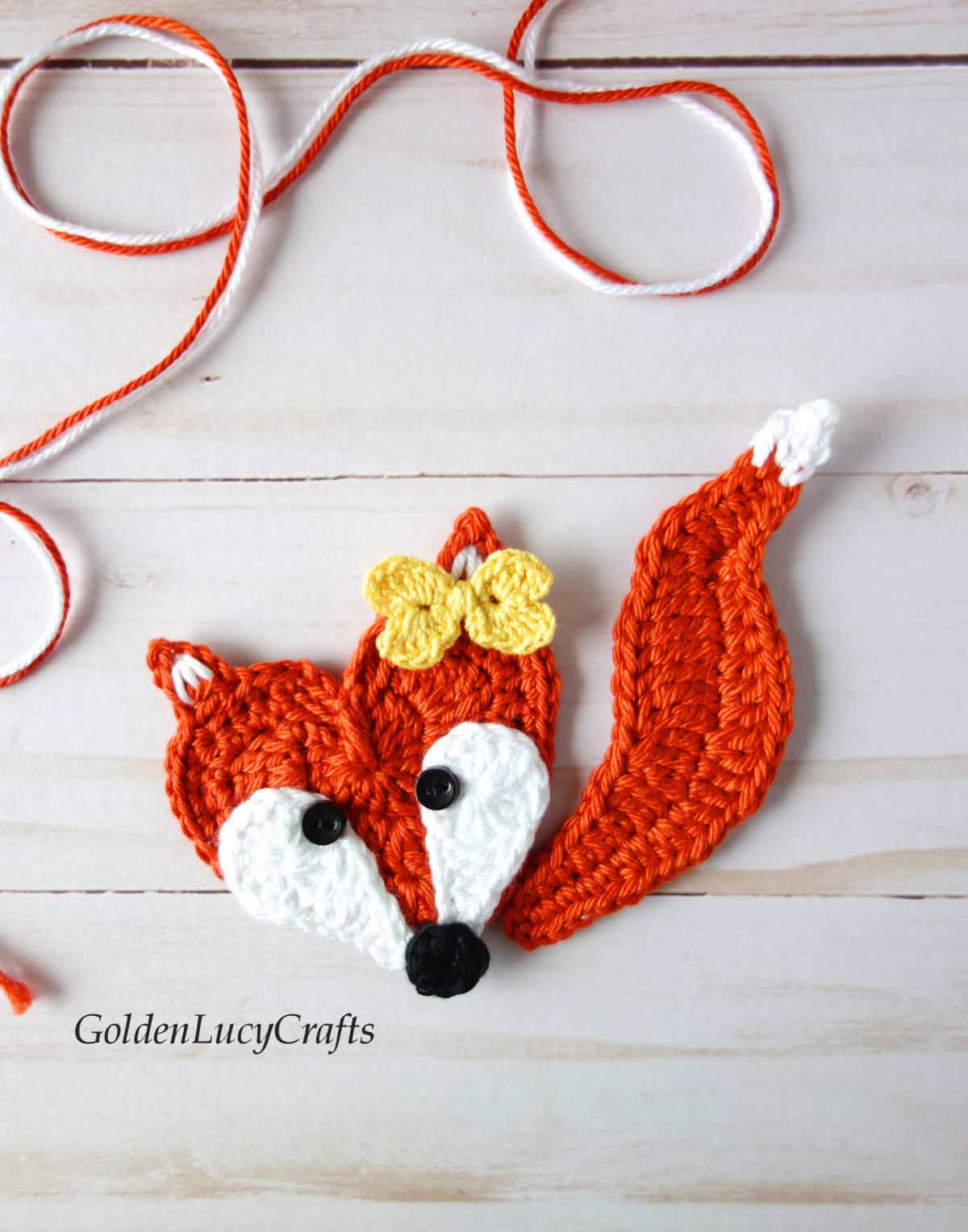 Crochet heart-shaped fox applique.