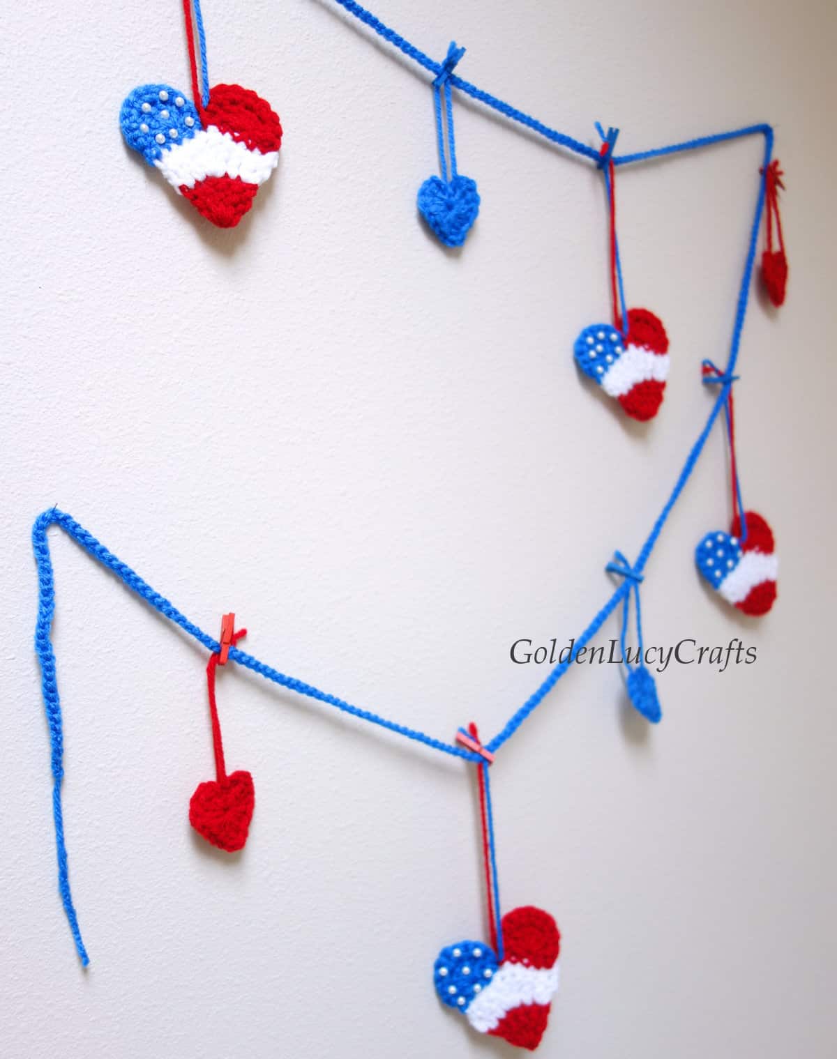 Crochet patriotic garland hanging on the wall.