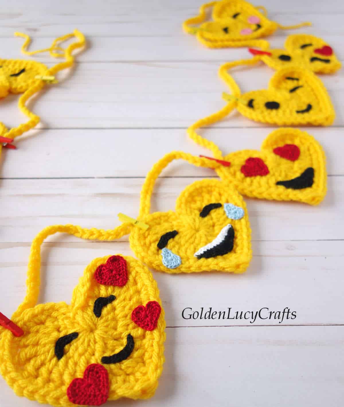 Crochet heart emoji garland, close up picture.