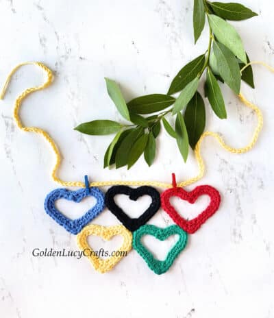 Crocheted Olympic garland made from heart-shaped Olympic rings.