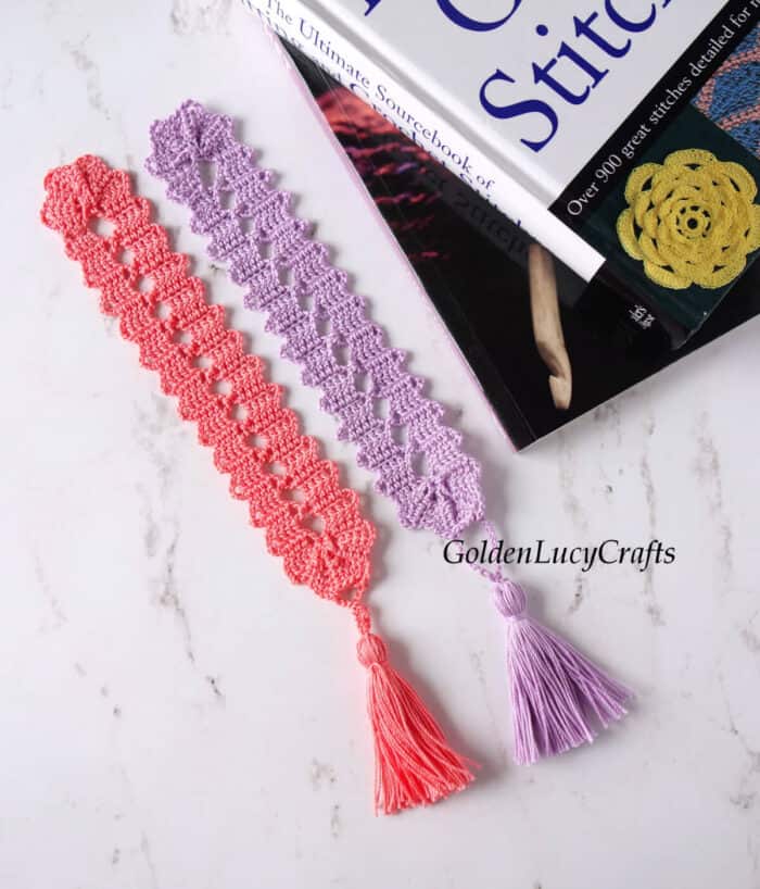 Two books and two crochet bookmarks.