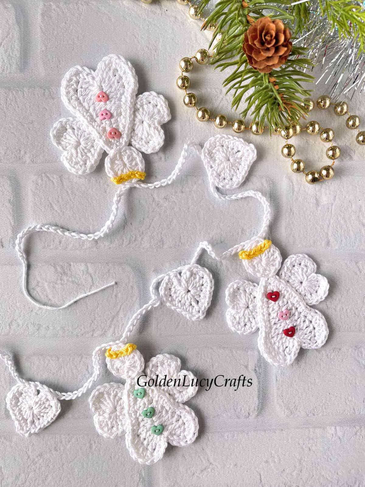 Crocheted angel garland close up picture.