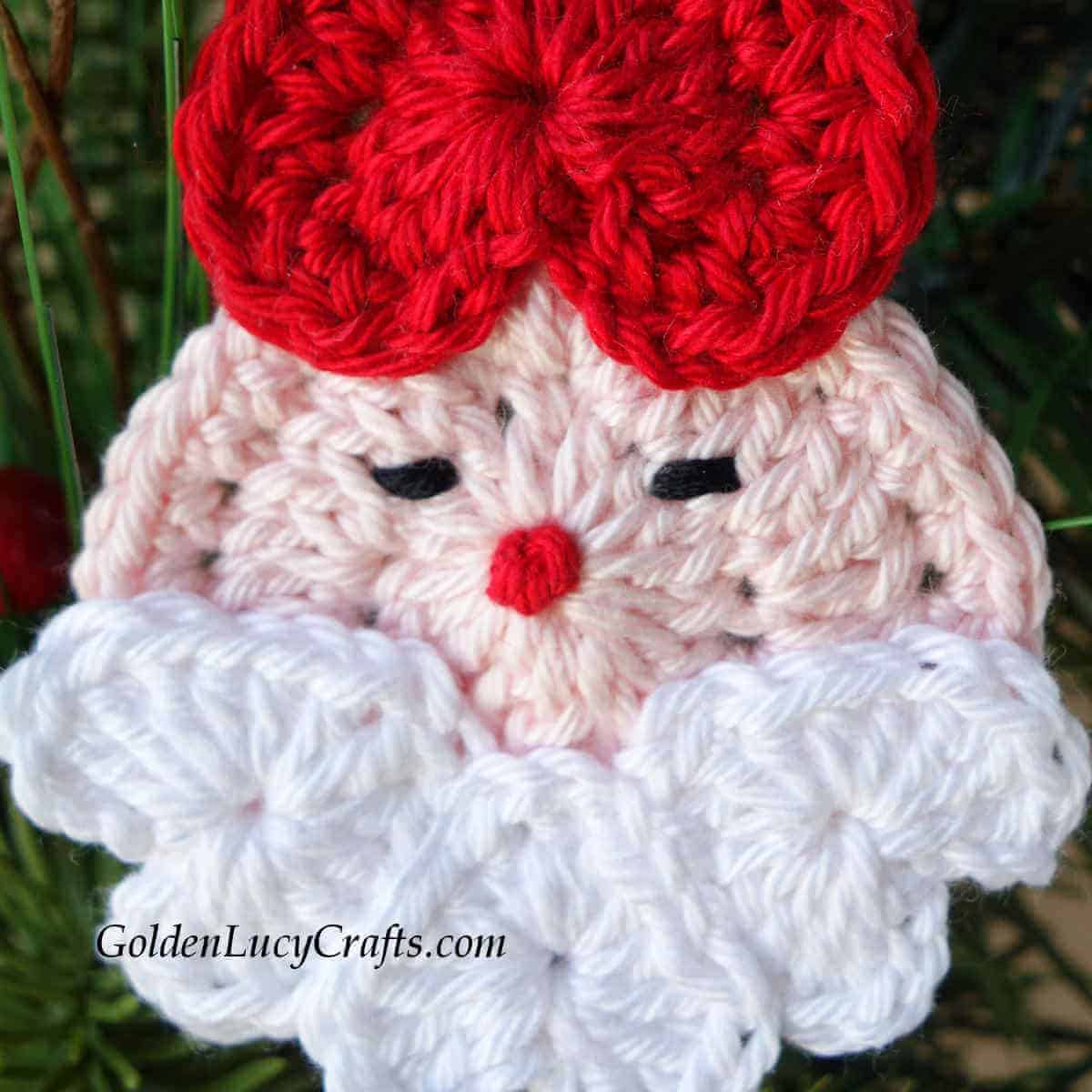 Santa crochet Christmas ornament close up picture.