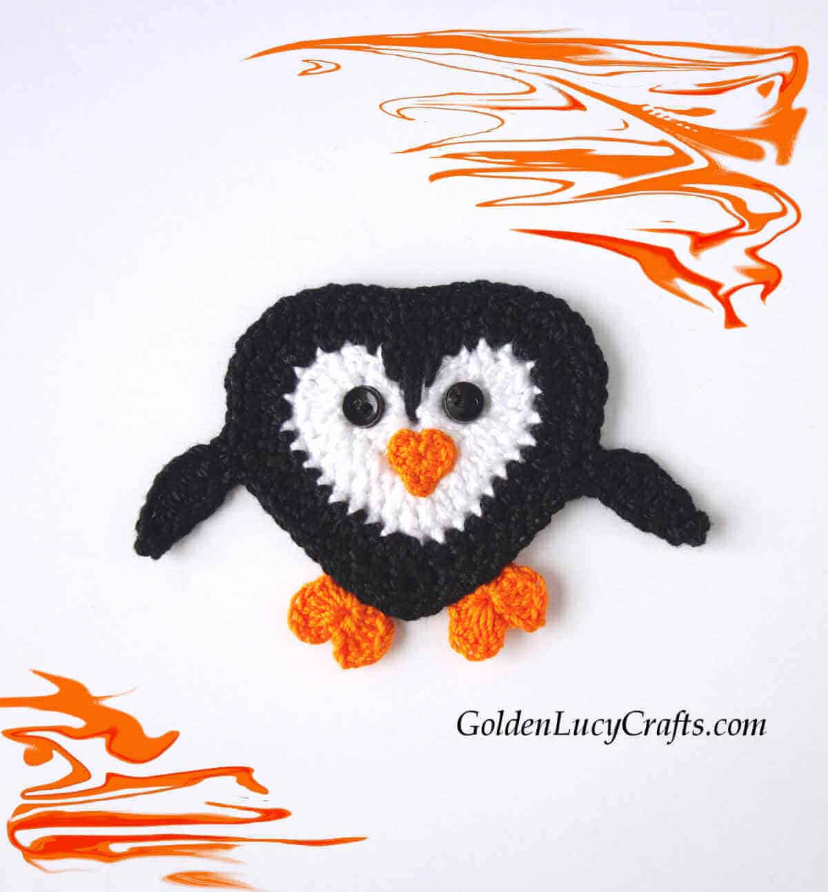 Crochet heart-shaped penguin applique.