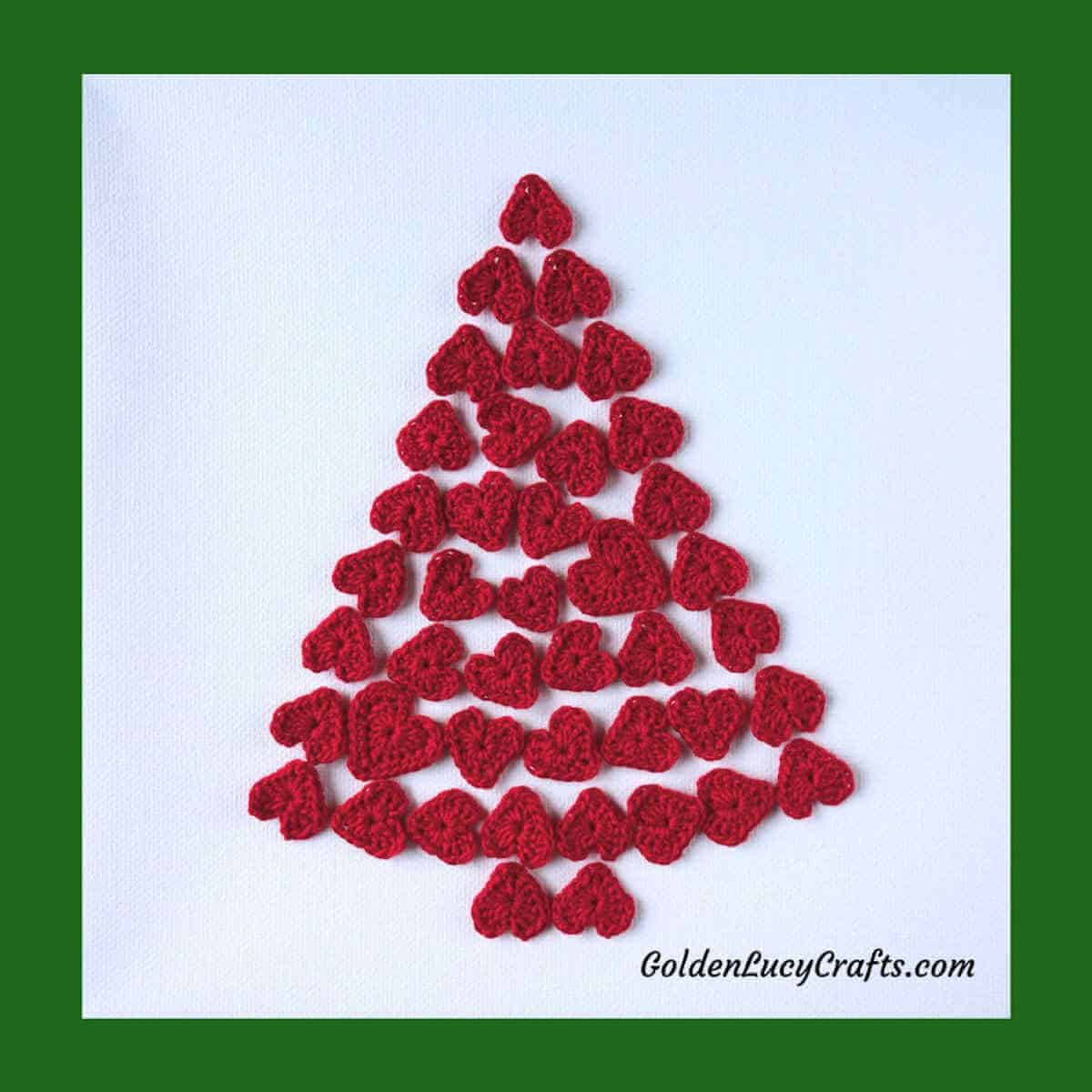 Christmas tree made from small crocheted red hearts.