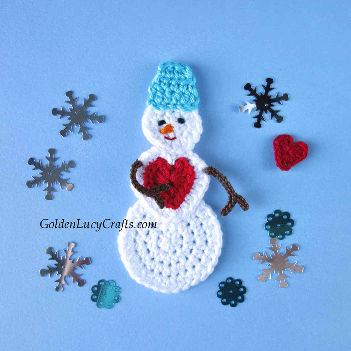 Snowman with red heart on his chest crocheted applique.