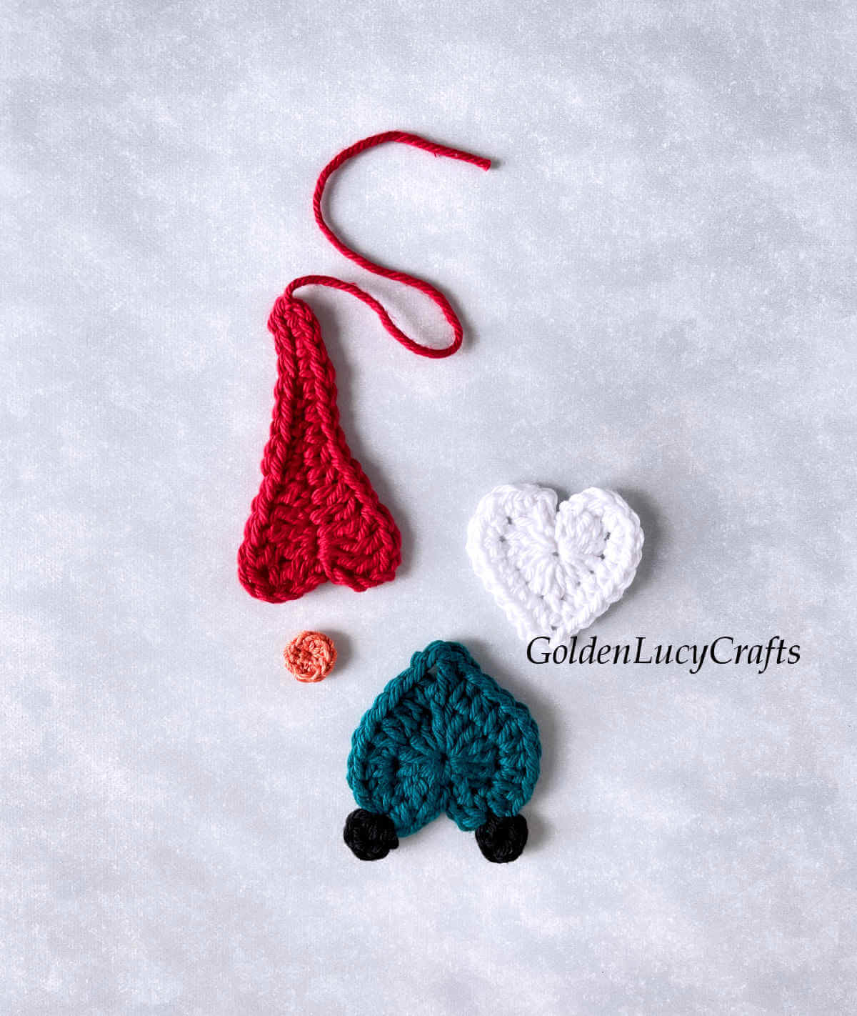 Parts of heart gnome crochet Christmas ornament.