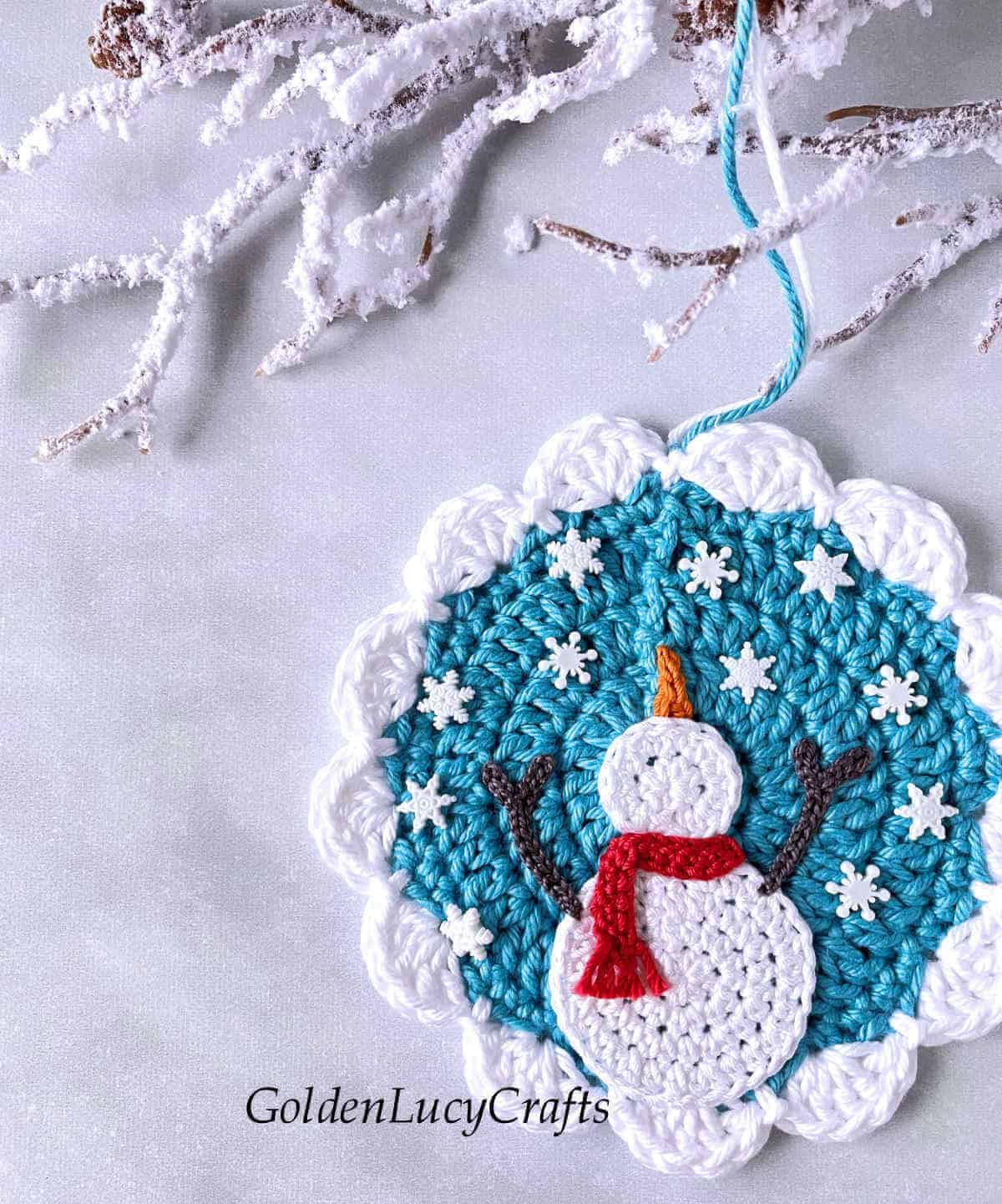 Crochet winter ornament close up image.