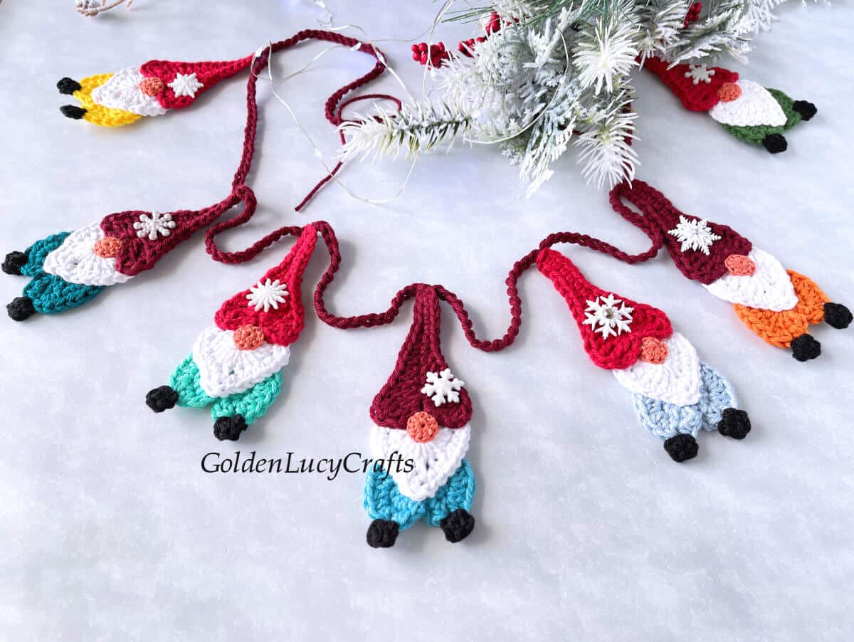 Crocheted gnome garland close up picture.