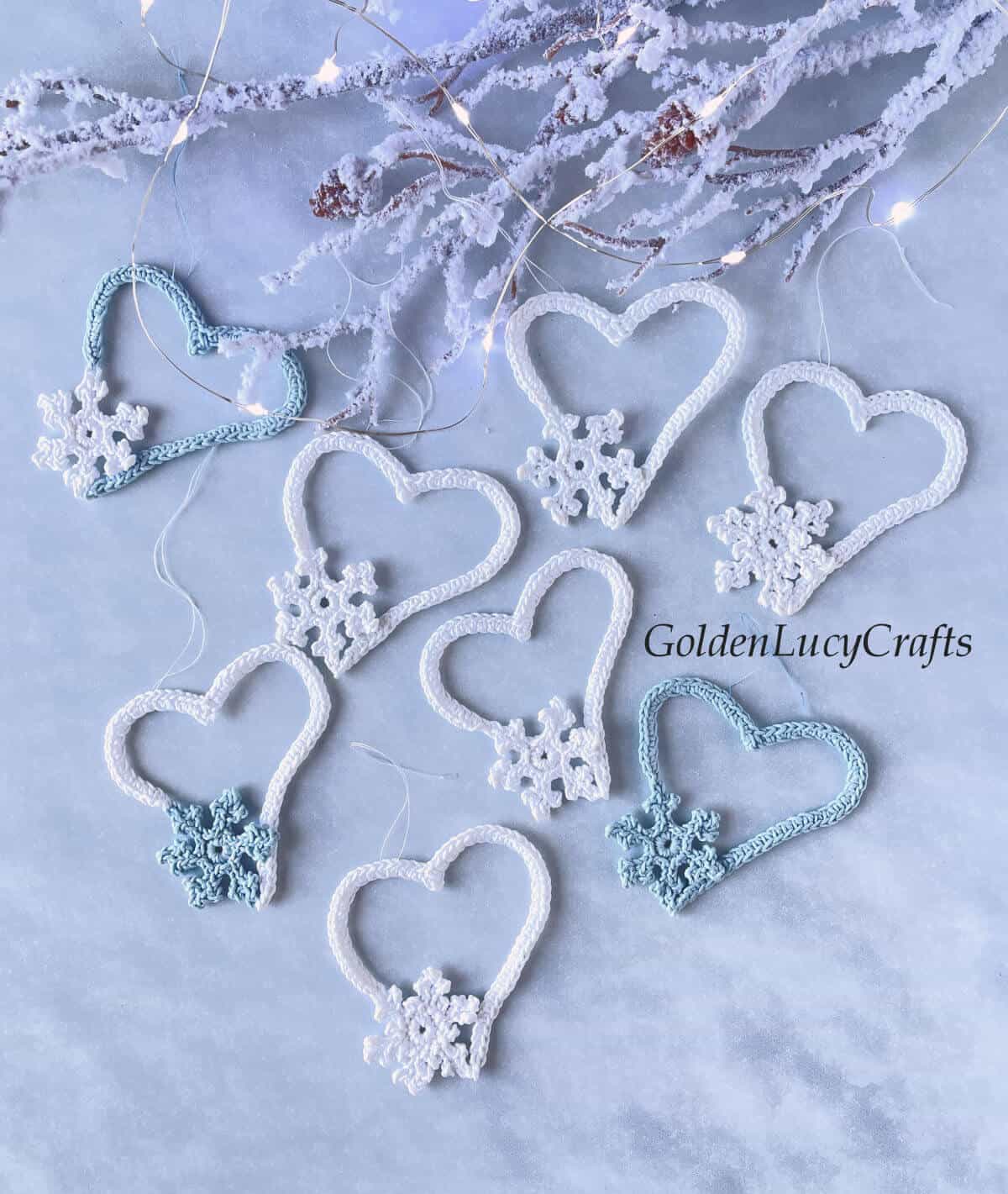 Bunch of crocheted snowflake hearts Christmas ornaments.