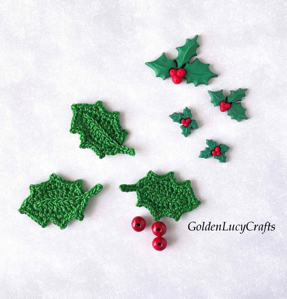 Crochet holly leaf appliques, red beads, decorative holly berry buttons.