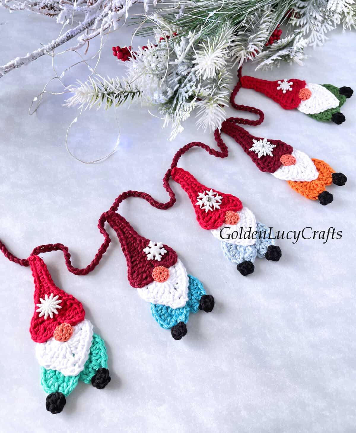 Part of crocheted gnome garland, close up picture.
