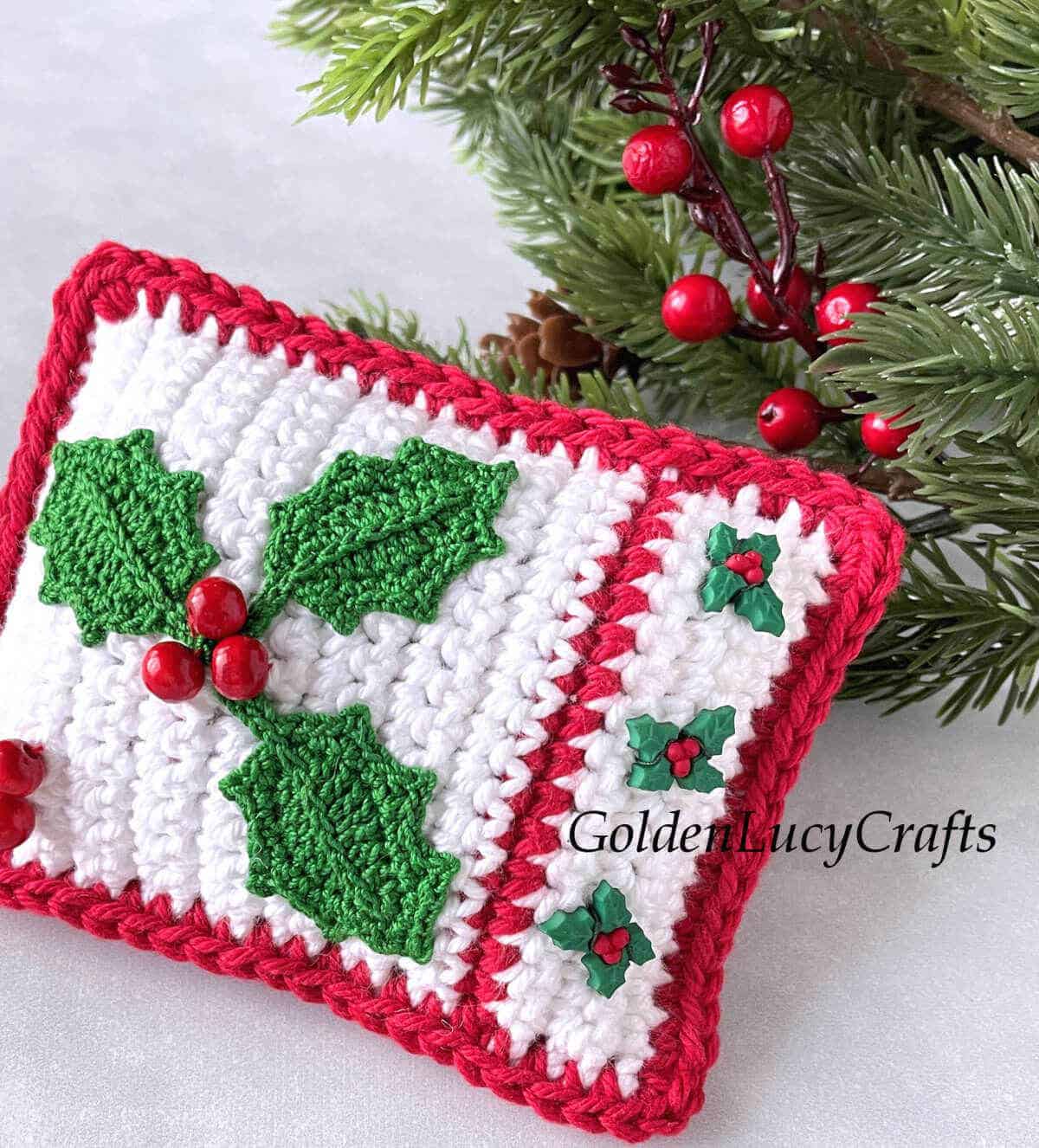 Crocheted mini pillow for Christmas decor close up picture.