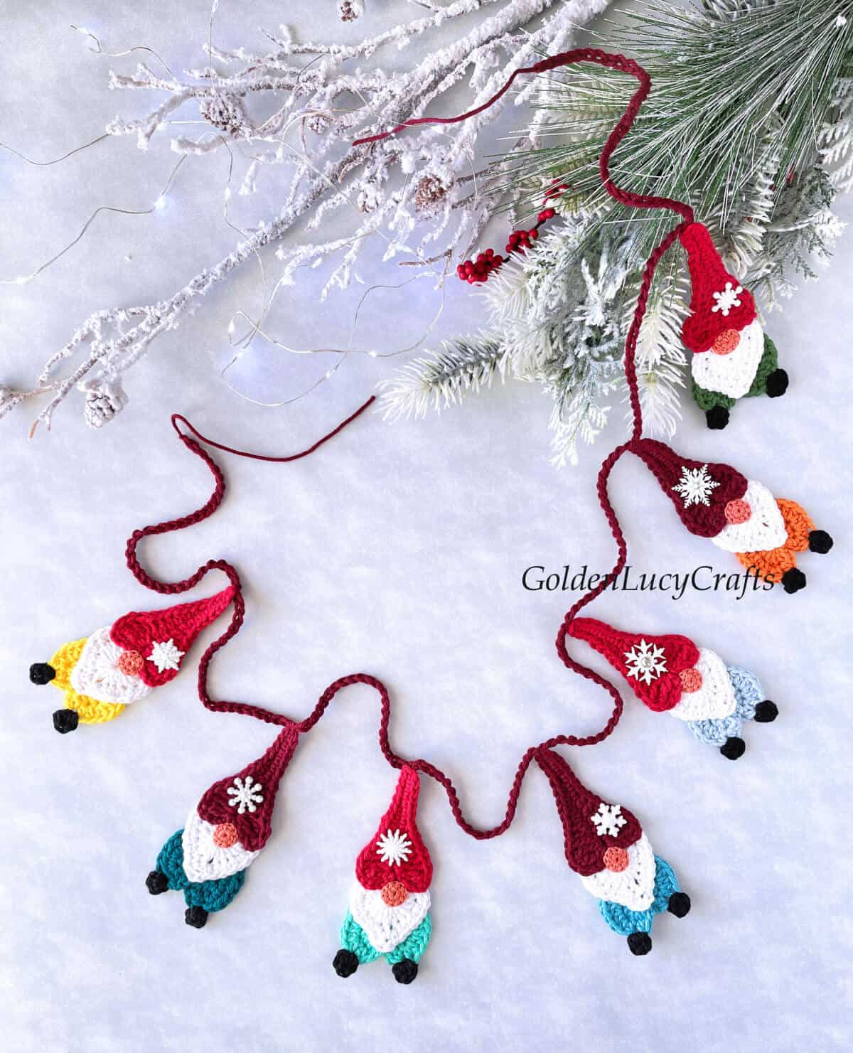 Christmas garland made from crocheted gnomes.