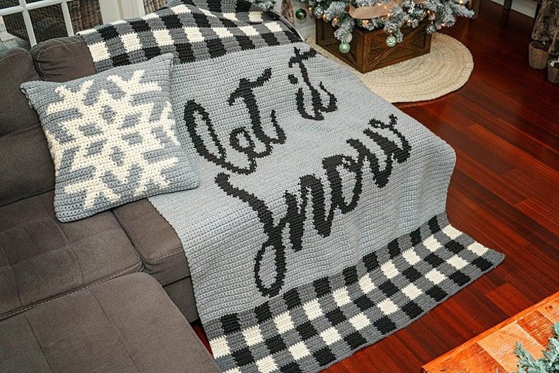 Crochet snowflake pillow, blanket with words let it snow.