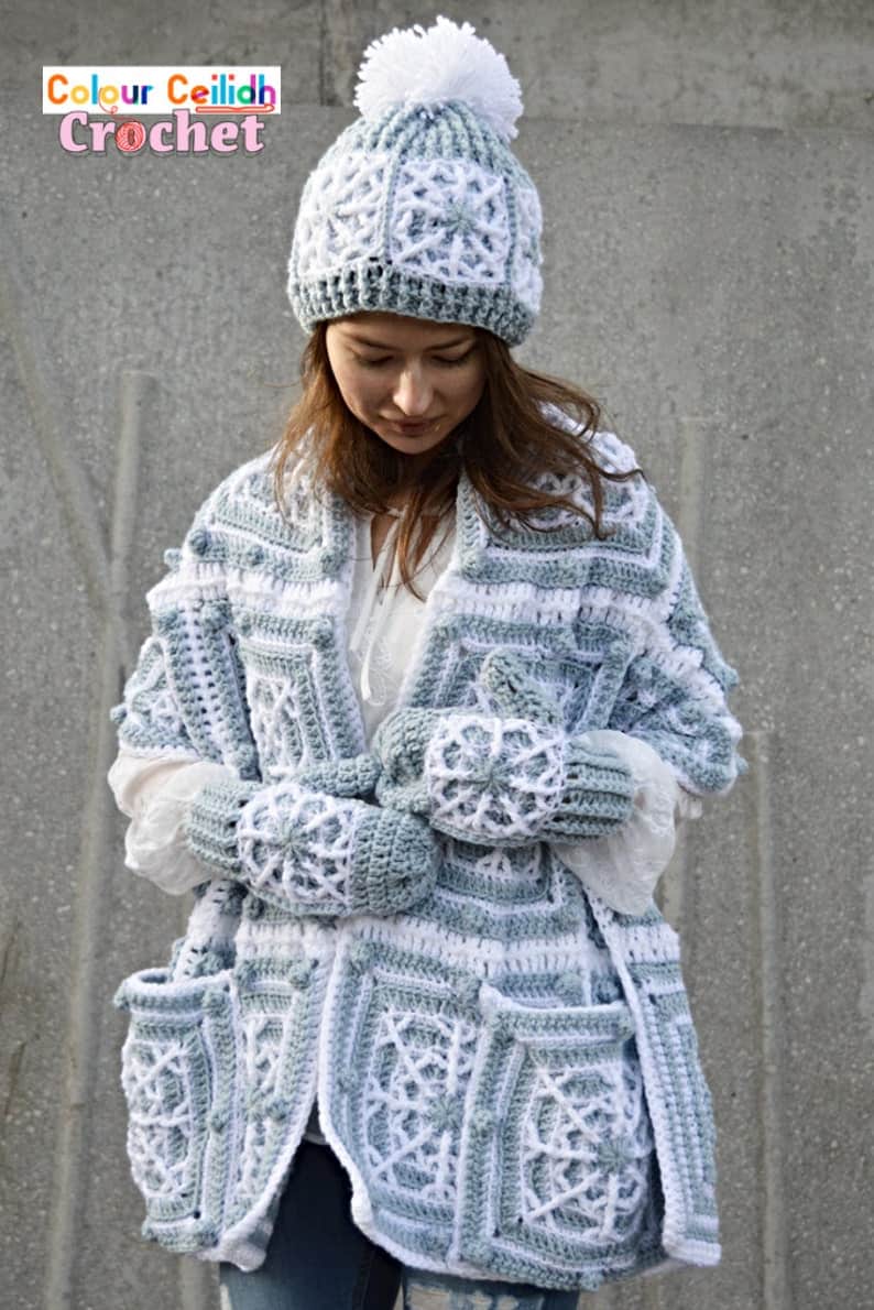 Model dressed in crocheted hat, scarf and mittens.