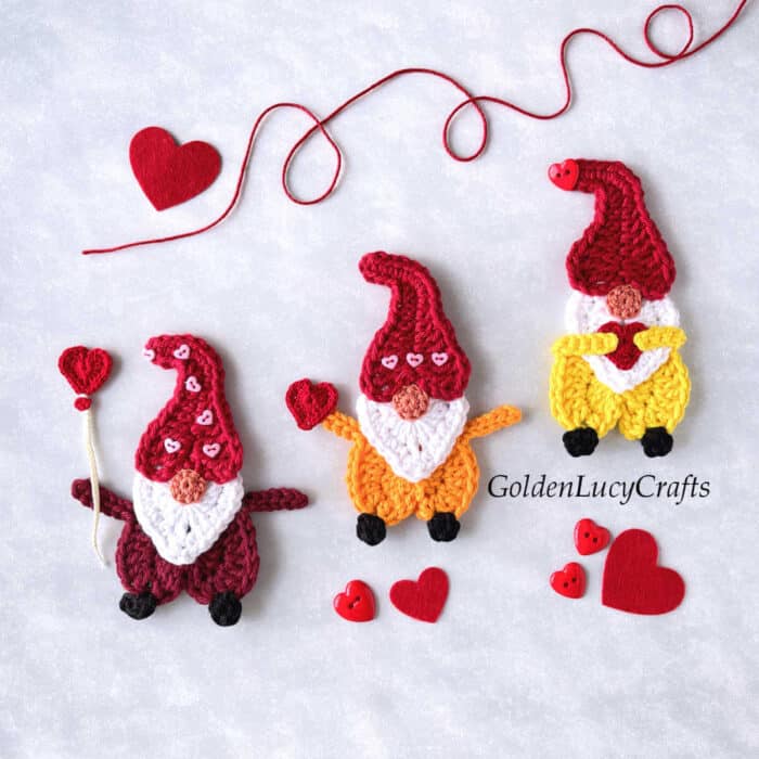 Three crochet Valentine's Day gnome appliques.