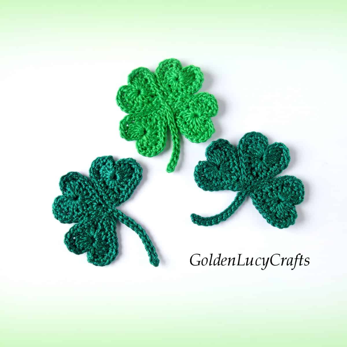 Crocheted shamrock and lucky clover appliques.