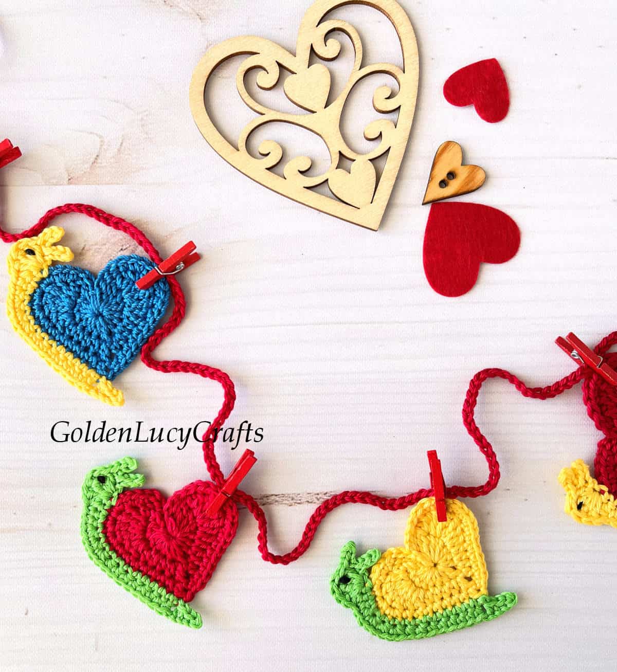 Crochet garland made from heart snail appliques.