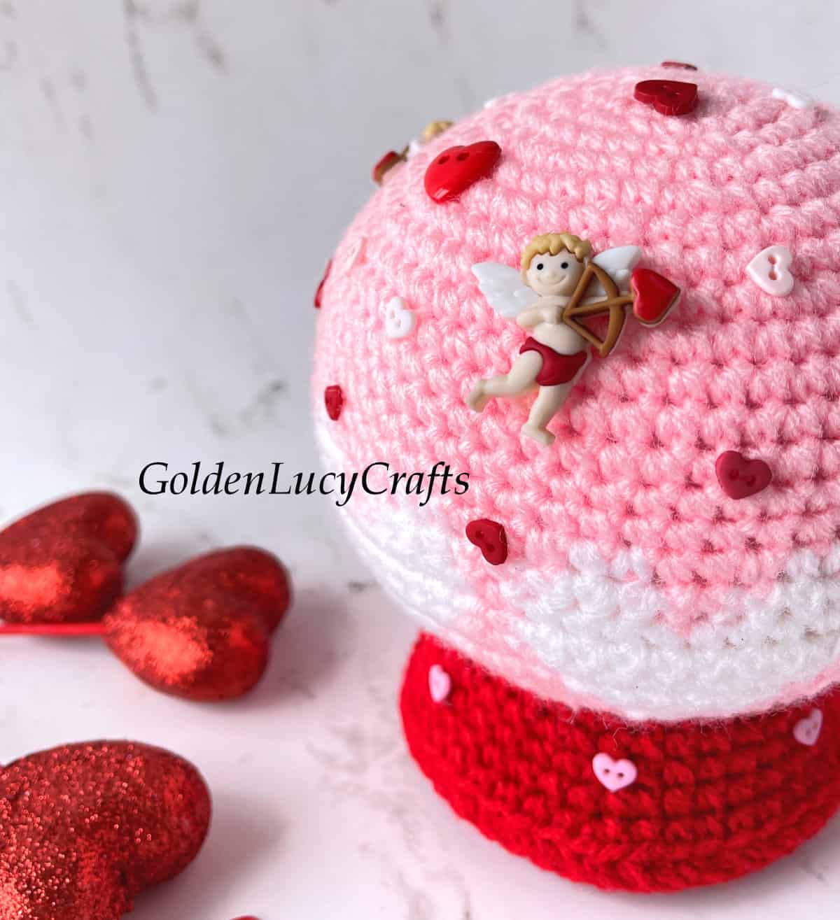 Valentine's Day crochet snow globe close up picture.