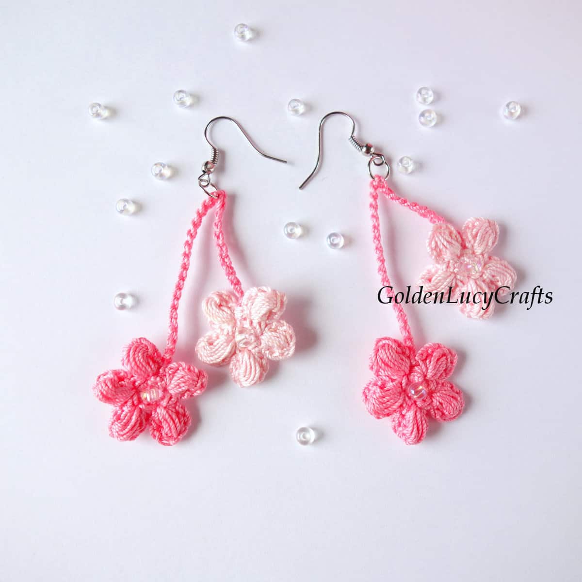 Crochet cherry blossom earrings in pink colors.