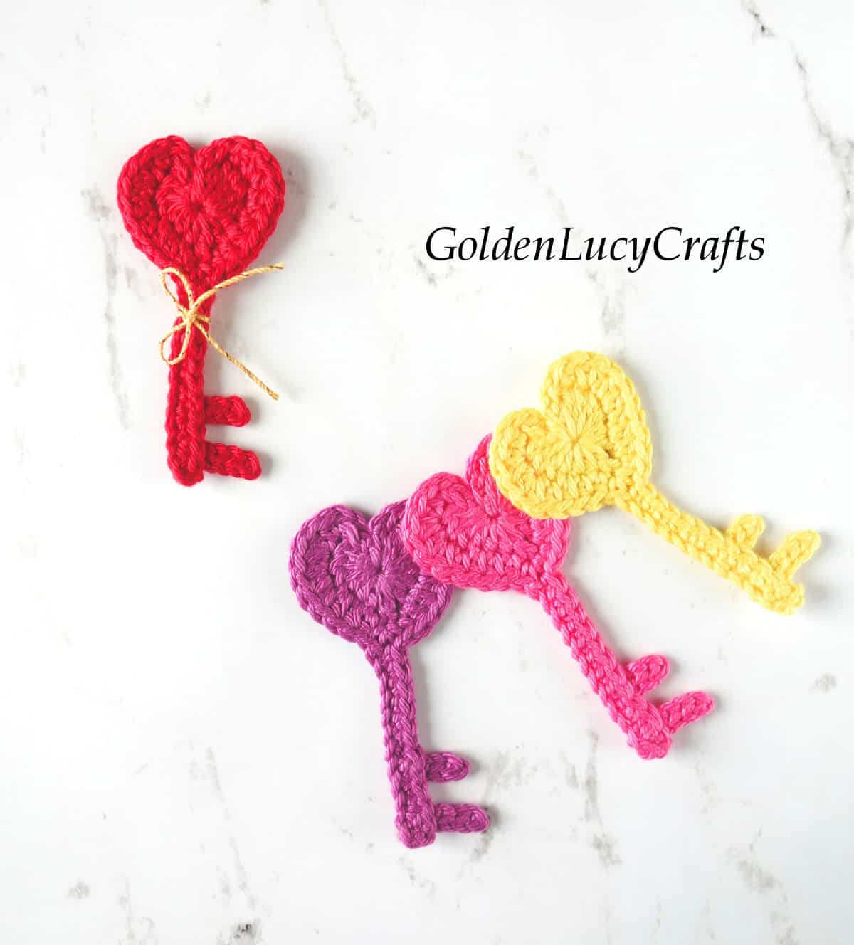 Crochet heart key appliques.